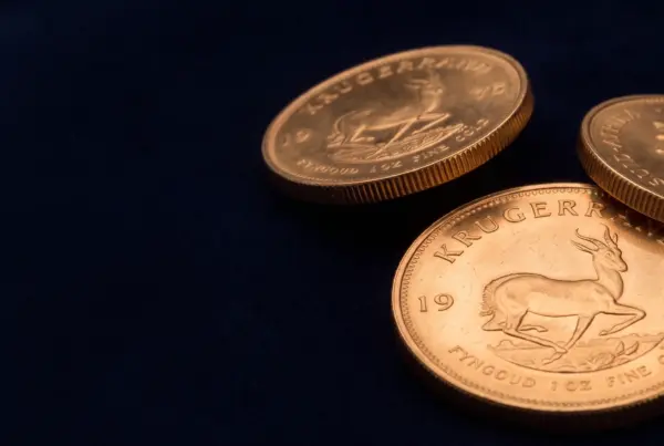 Monete Krugerrand in oro su velluto blu